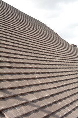 Rows of new tiles fixed to roof