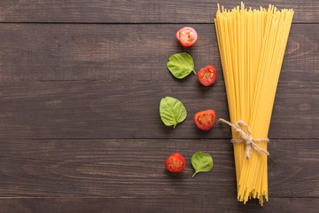 Pasta ingredients. tomato on the wooden background