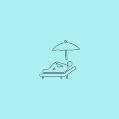 relax under an umbrella on a lounger