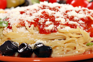 spaghetti with tomatoes and olives food background