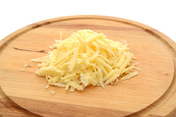 Grated cheese on a wooden board