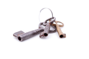 Old key closeup isolated on white background