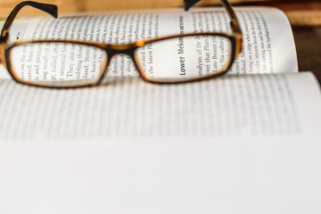 eyeglasses and book