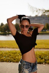 Portrait young sexy swag fashion style girl posing at city park