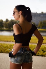 Portrait young sexy swag fashion style girl posing at city park