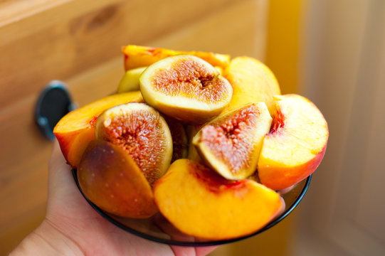 Studio shot of fresh fig fruits and fresh peaches