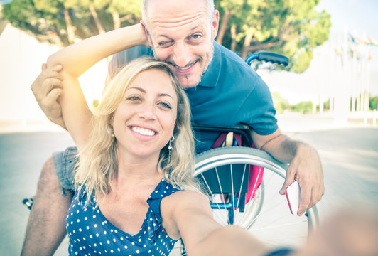 Happy Couple In Love Taking Selfie On Handicap Wheelchair