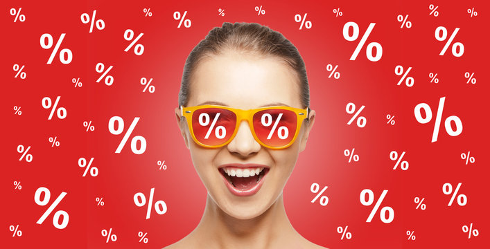 happy teenage girl in shades with percentage signs