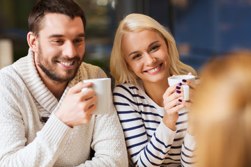 happy couple meeting and drinking tea or coffee
