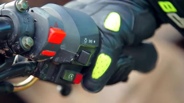 Biker Pressing Start Button and Bending the Throttle of the