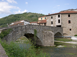 Fototapeta na wymiar Ancient old bridge at Gragnola in Lunigiana, Italy.