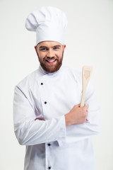 Portrait of a smiling chef cook holding spoon