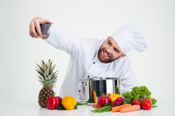 Male chef cook making selfie photo