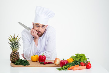 Portrait of a young chef cook preparing food