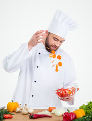 Male chef cook preparing salad