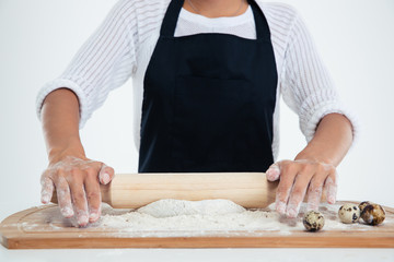 Female hands working on unfinished dough