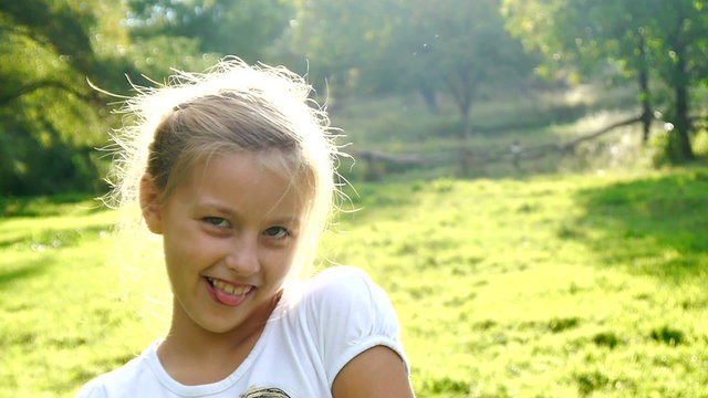 Playful and happy young girl smiling and  flirting