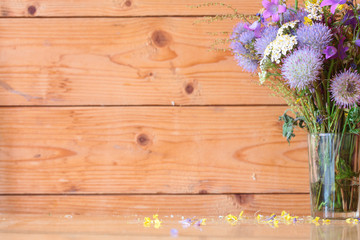 Purple flowers on a background of wooden boards