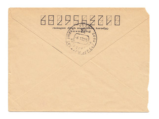 Old worn envelope with USSR meter stamp, worn and yellowed paper, closed, isolated on white background. Russian inscription: "Attention! Sample of filling zip-code"