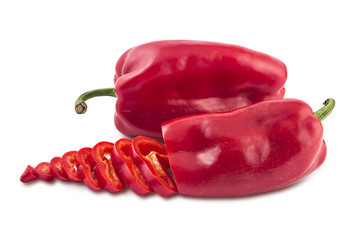 Two fresh sweet red peppers, one sliced, isolated on white background
