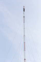 Thai worker is working on high communication tower