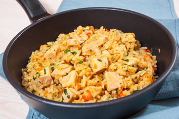 Chicken Breast with Rice and vegetables in a frying pan