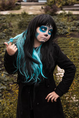 Girl in Halloween makeup - mexican Santa Muerte mask 
