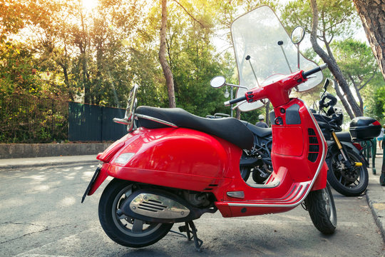  Classic red old style scooter stands parked