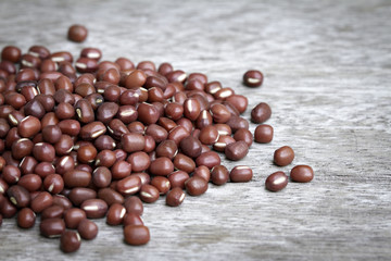 Red beans pile  on wooden background.