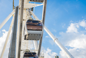 Ferris wheel on the background of a beautiful sky.
