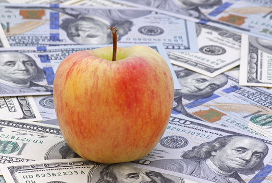 Close Up Of Apple On Money