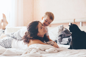 Mom relaxing with her little son