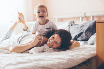 Mom relaxing with her little son