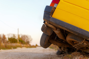 car wheels got stuck in a ditch. minibus hit the road accident and got bogged down in a ditch, close-up rear of the car