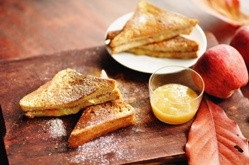 Sandwich with apple filling applesauce and apples in background