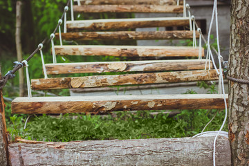 Wooden stairs in the green forest park