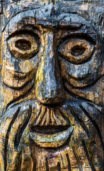 Fototapeta na wymiar Wooden Old Man Face Carving