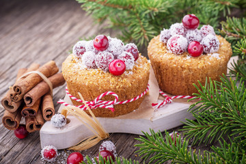 Cranberry muffins with powdered sugar and fresh berries