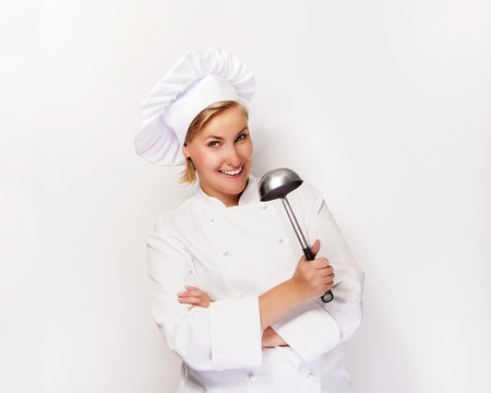 Young Woman Chef Holding Ladle, Smiling.