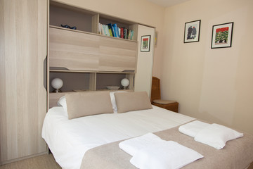 A very beautiful large bed in a bedroom