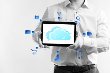 Fototapeta na wymiar Businessman with cloud computing diagram on tablet-pc, modern technology concept