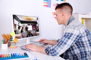 Portrait of businessman attending video conference