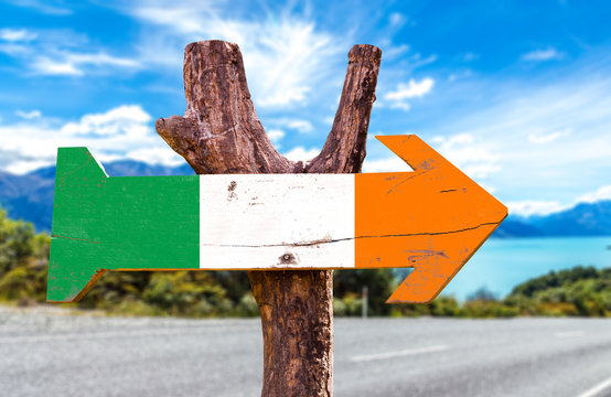 Ireland flag wooden sign with road background