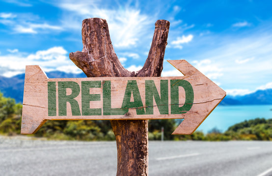 Ireland wooden sign with road background