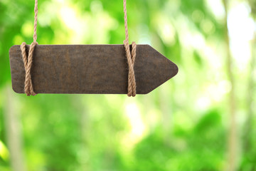 Wooden sign arrow on nature background