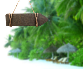 Wooden sign arrow on nature background