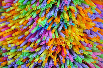 Fototapeta premium Colorful background with multicolored tube of straws in fullframe