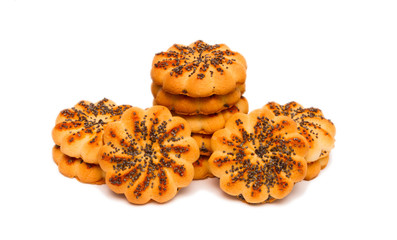 Round sugar cookies with poppy seeds on a white background.
