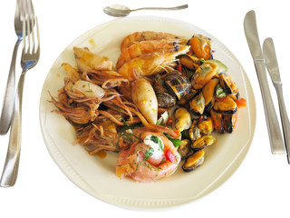 Raw Mixed seafood shrimps, octopus and mussels on dish