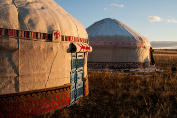 Kazakh yourt in evening steppe. - obrazy, fototapety, plakaty